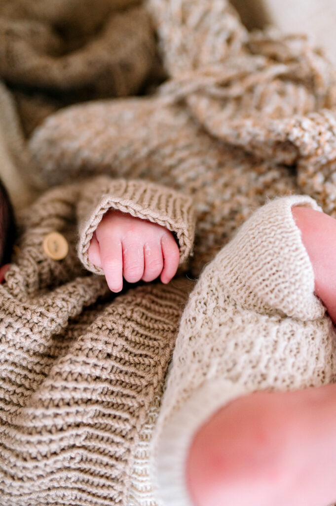 Babies hand while asleep on back during a newborn session in Prosper, Texas. 